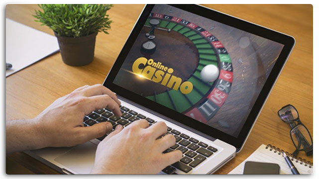 Person on Laptop Playing an Online Casino Game