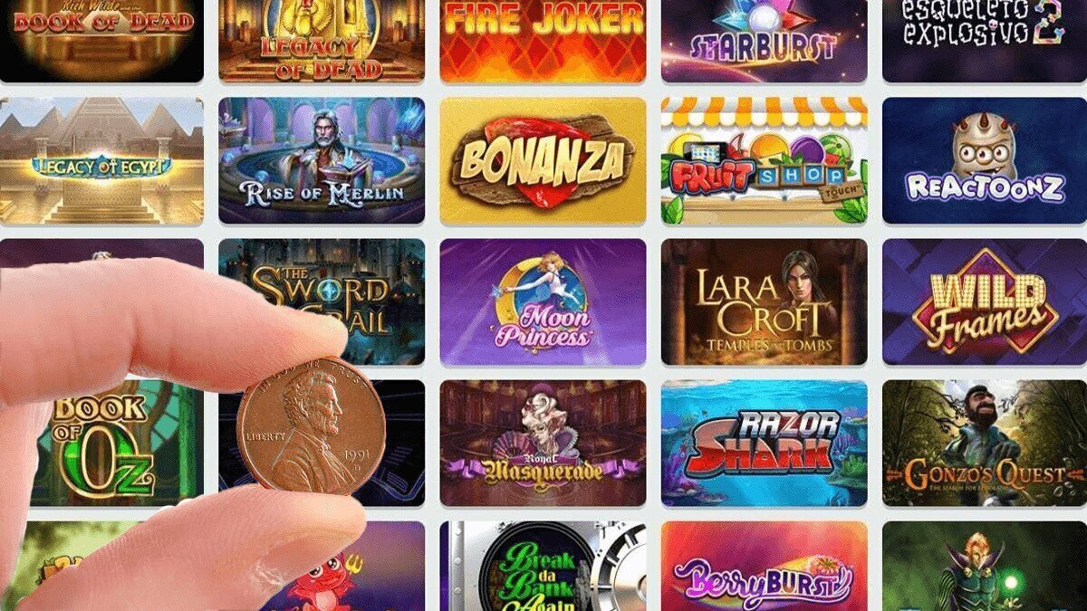Hand holding penny in front of online penny slots