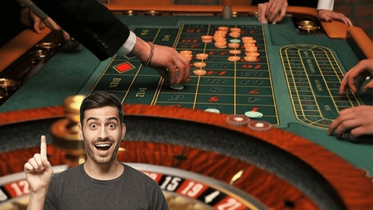 Smiling Man in Front of a Roulette Table